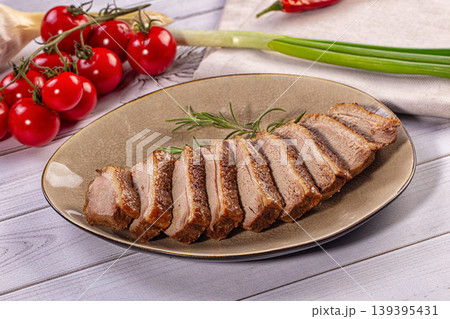 Gourmet Pan Seared Duck Breast Slices Served with Fresh Cherry Tomatoes 139395431