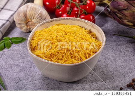 Uncooked Vermicelli Pasta Bowl with Fresh Mediterranean Ingredients Uncooked Vermicelli Pasta Bowl with Fresh Mediterranean Ingredients 139395451