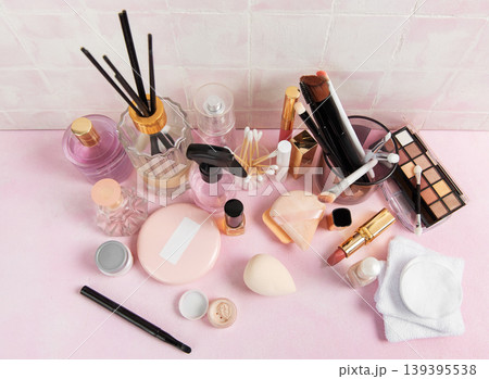 Beauty products and makeup tools promoting cosmetics routine Beauty products and makeup tools promoting cosmetics routine 139395538