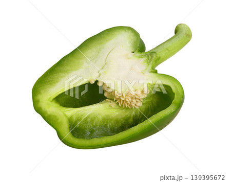 Green bell pepper half revealing vibrant interior and seeds Green bell pepper half revealing vibrant interior and seeds 139395672