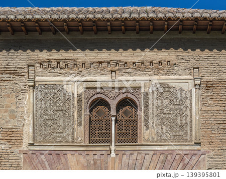Moorish Carved Stone Window With Wooden Lattice and Intricate Islamic Plasterwork, Alhambra, Granada 139395801
