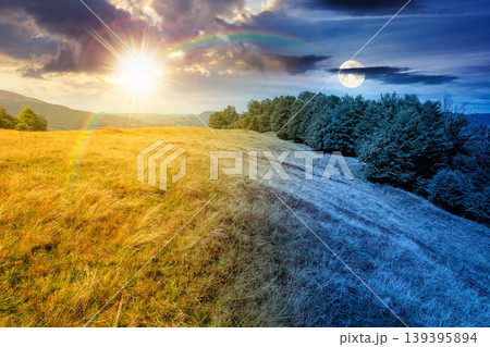 day meet night above carpathian mountain field. view of countryside landscape with valley behind the forest on the hill. sun and moon over clouds on a sky. autumn equinox background for astrology 139395894