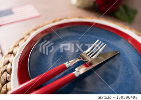Patriotic tableware close up with red and blue plate and cutlery Patriotic tableware close up with red and blue plate and cutlery 139396498