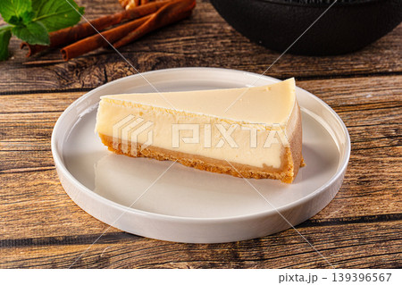 Classic delicous cheesecake slice served mint Classic delicous cheesecake slice served mint 139396567