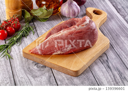 Raw pork sirloing over board Raw pork sirloing over board 139396601