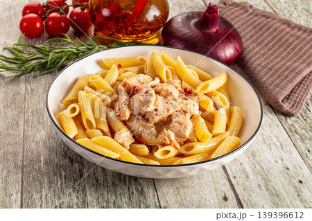 Pasta penne with chicken in cream sauce Pasta penne with chicken in cream sauce 139396612