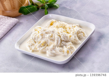 Italian soft young stracciatella cheese Italian soft young stracciatella cheese 139396748