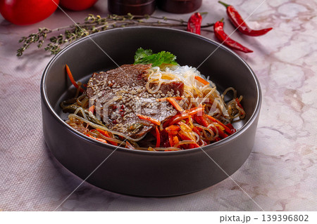 Asian funchosa noodles with beef 139396802