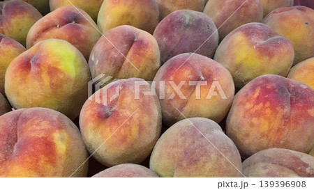 Fresh ripe peaches background, organic sweet summer fruits close-up Fresh ripe peaches background, organic sweet summer fruits close-up 139396908