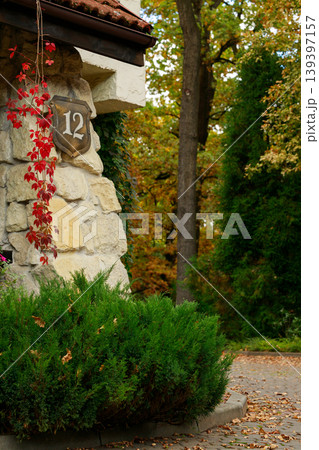 manor town house porch facade bushes garden back yard court space vertical photography autumn aesthetic 139397157