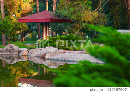 warm sun light morning peaceful nature water edge of small part with umbrella summer season in Ukrainian capital Kyiv city square warm sun light morning peaceful nature water edge of small part with umbrella summer season in Ukrainian capital Kyiv city square 139397607