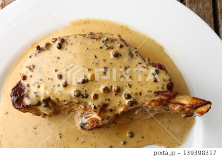 Entrecote Steak with Green Pepper Sauce on Plate Entrecote Steak with Green Pepper Sauce on Plate 139398317