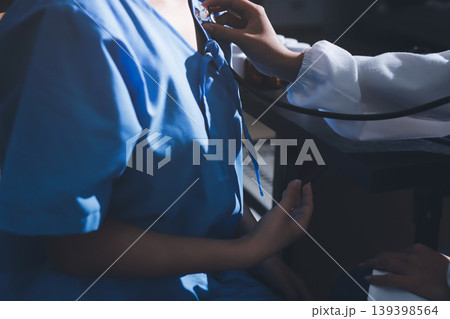 healthy concept; Doctor checking patient's heart with stethoscope at a hospital 139398564