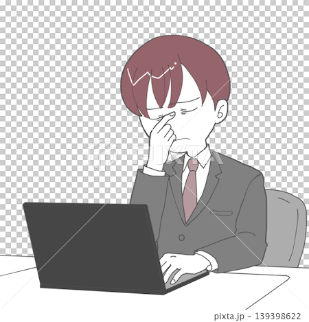 A man wiping the corner of his eye while working at his desk. 139398622