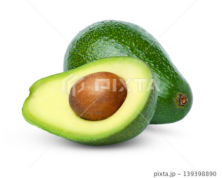 Fresh avocado and cut in a half of fuerte avocado with seed isolated. Green avocados with clipping path. 139398890