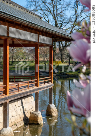 Japanese veranda with blossoms. Architectural and floral elements in layered landscape Japanese veranda with blossoms. Architectural and floral elements in layered landscape 139399095