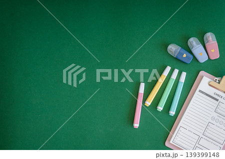 Colorful school supplies on a green background Colorful school supplies on a green background 139399148