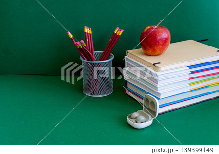 Colorful school supplies on a green background 139399149