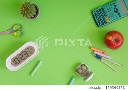 Colorful school supplies on a green background Colorful school supplies on a green background 139399158