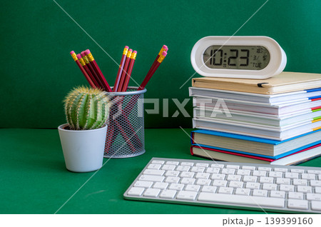 Colorful school supplies on a green background 139399160