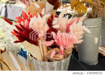 Colorful dried flowers bouquet supplies in galvanized buckets at a market Colorful dried flowers bouquet supplies in galvanized buckets at a market 139399232
