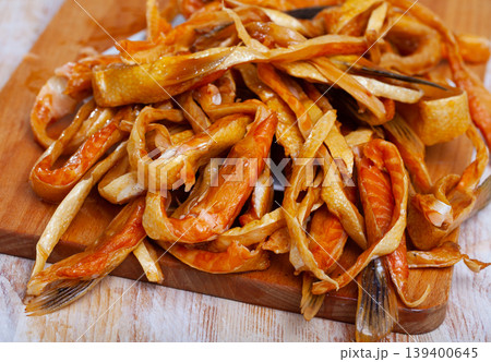Delicious smoked salmon strips with parsley 139400645