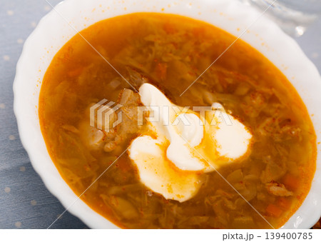 Russian-style cabbage soup Shchi of pork broth with boiled vegetables Russian-style cabbage soup Shchi of pork broth with boiled vegetables 139400785