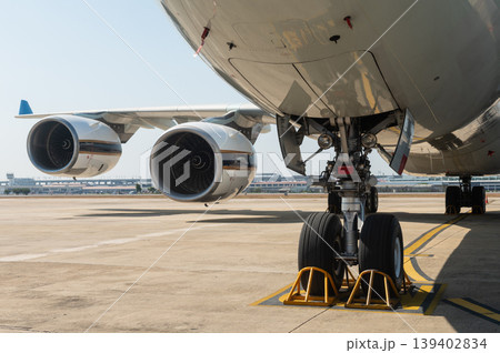 Wide-body commercial aircraft with four engines and landing gear 139402834