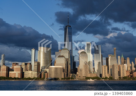 New York city of America. Skyscraper building of NYC. NY city architecture. Midtown Manhattan at Hudson river. Sunset city. Cityscape in sunrise. New York downtown. Manhattan skyline. Dramatic sky 139403860