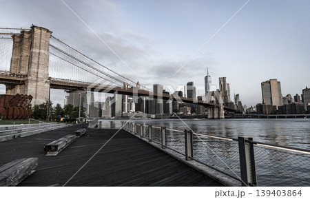 Brooklyn bridge in New York. Manhattan cityscape. Amazing scenery of Brooklyn bridge over skyscraper in New York. Architecture of historic bridge in Brooklyn. Way to Manhattan 139403864