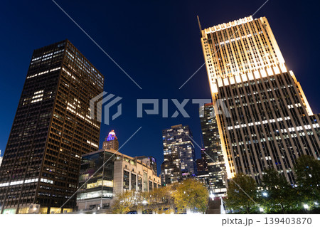 Business city. Night cityscape of Chicago skyscraper building. Chicago architecture of skyscraper. City night illuminated building. Skyscraper cityscape. Night city of Chicago. City hum Business city. Night cityscape of Chicago skyscraper building. Chicago architecture of skyscraper. City night illuminated building. Skyscraper cityscape. Night city of Chicago. City hum 139403870