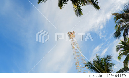 High Watchtower against Blue Sky with Palm Tree Frames High Watchtower against Blue Sky with Palm Tree Frames 139404179