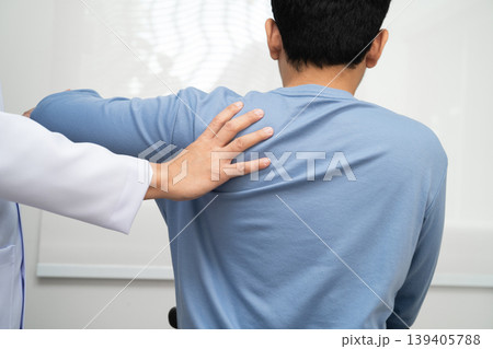 Physical therapy, Asian therapist doctor treat perform pain young man in hospital. 139405788