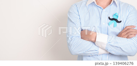 Man with blue Ribbon and mustache for Blue November, November Prostate Cancer Awareness month, World Diabetes day , Men Health month, June International men, Father day. Healthcare and world cancer 139406276