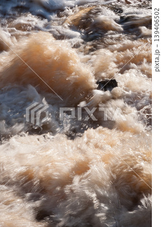 Foaming water in raging rapids in spring Foaming water in raging rapids in spring 139406502