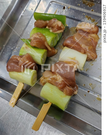 Raw Yakitori Negima Chicken and Green Onion Skewers Prepared for Grilling 139406917