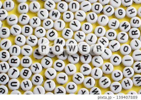 The word POWER made of white rounded blocks that lays on other blocks with letters. Symbol of power, authority, domination, command The word POWER made of white rounded blocks that lays on other blocks with letters. Symbol of power, authority, domination, command 139407889