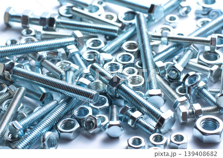 Bolts and nuts of different size isolated on white background 139408682