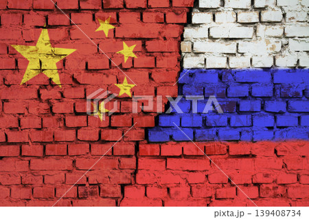 Flags of European Union and Russia on the brick wall with big crack in the middle. Symbol of problems between the country and the union 139408734