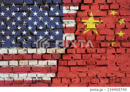 Flags of United States and China on the brick wall with big crack in the middle. Symbol of problems between countries 139408740