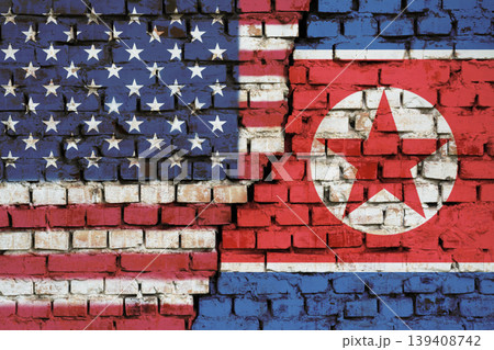 Flags of USA and North Korea on the brick wall with big crack in the middle. Symbol of problems between countries 139408742