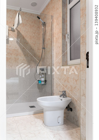 Small hotel bathroom interior with walk-in shower and bidet Small hotel bathroom interior with walk-in shower and bidet 139408932