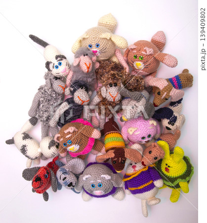 Various knitted woolen toys on a white background Various knitted woolen toys on a white background 139409802