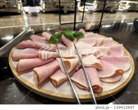 Assortment of freshly sliced deli ham and cold...の写真素材 [139412697] - PIXTA
