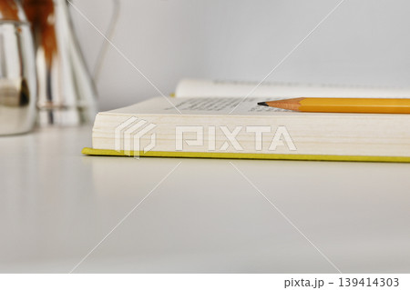 Pencil on opened book Pencil on opened book 139414303