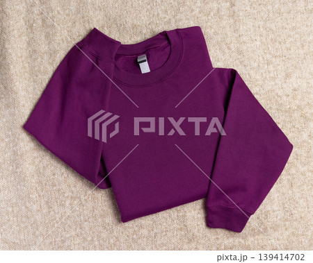 Blank purple unisex sweatshirt mockup, folded apparel template with copy space on front and sleeve 139414702