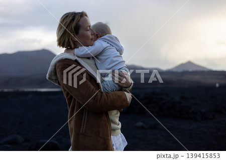 Authentic moment of love and connection between mother and toddler near the sea Authentic moment of love and connection between mother and toddler near the sea 139415853