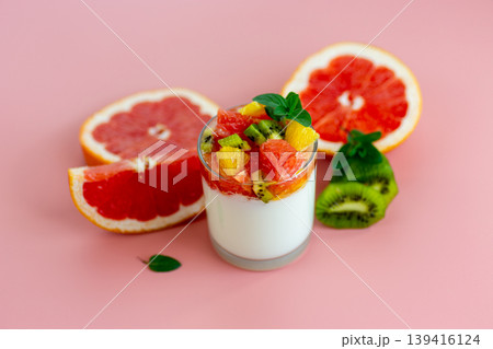 bright fruit composition with yogurt glass and grapefruit kiwi orange slices bright fruit composition with yogurt glass and grapefruit kiwi orange slices 139416124