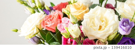 This seasonal bouquet of roses, eucalyptus, and eustoma in soft pink, white, and purple tones makes an ideal gift for anniversaries, birthdays, or any special event, banner This seasonal bouquet of roses, eucalyptus, and eustoma in soft pink, white, and purple tones makes an ideal gift for anniversaries, birthdays, or any special event, banner 139416810