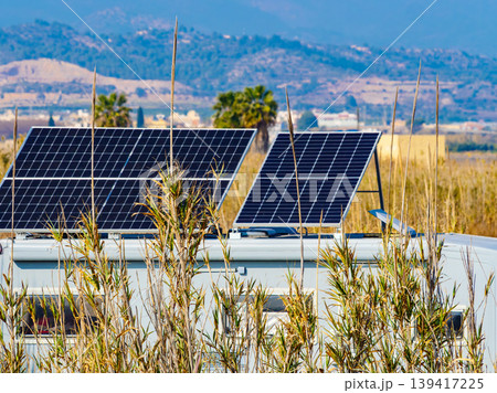 Caravan with tilt solar panels on roof. 139417225